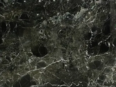 Green Levante natural stone slab — deep green with white veining