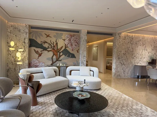 Living room with a white patterned marble feature wall